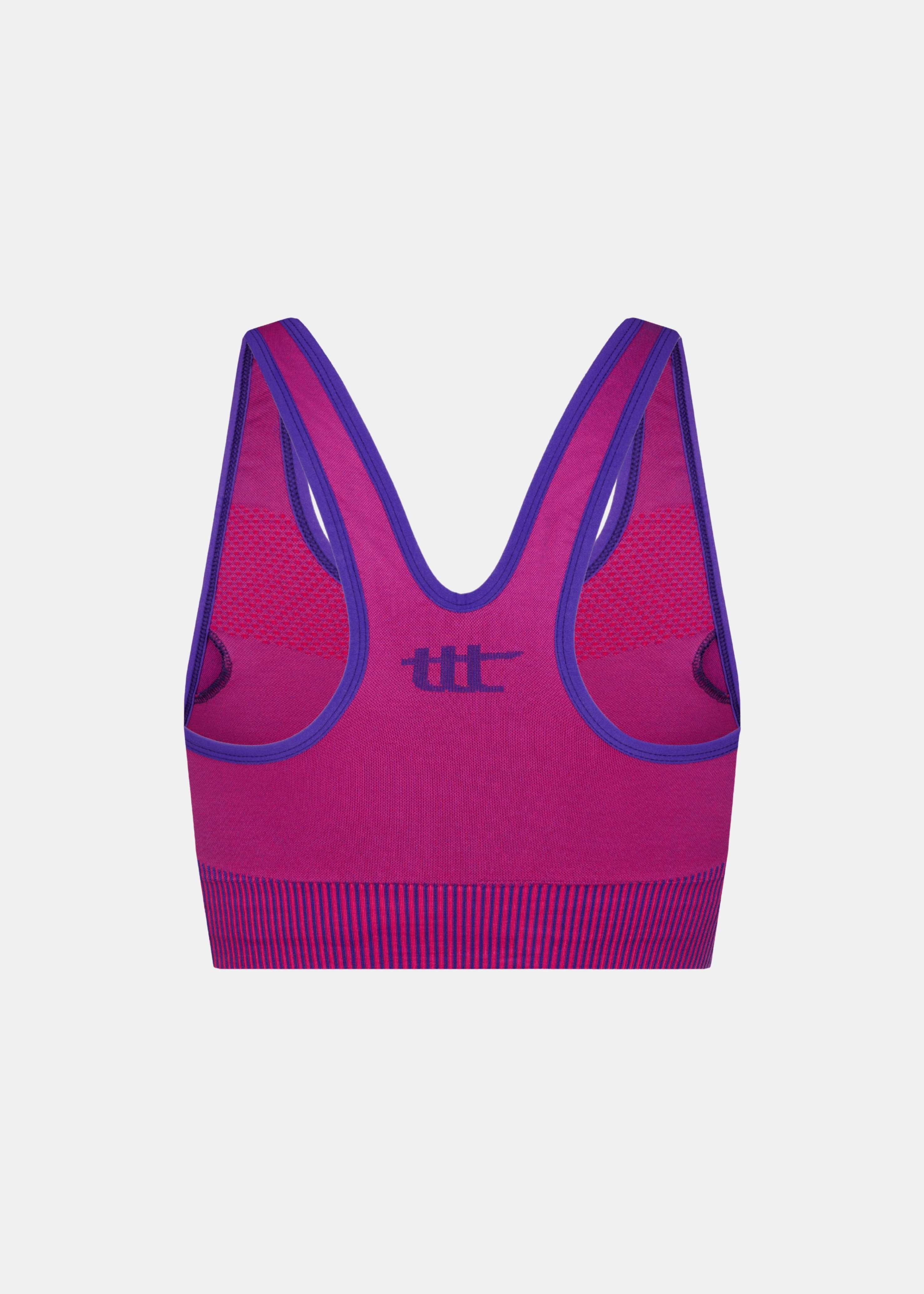 Rückenansicht des Magenta Sport-BHs mit nahtloser Verarbeitung und funktionalem Design.